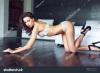 stock-photo-sexy-brunette-woman-in-white-underwear-kneeling-on-floor-red-lips-glamour-436554625.jpg